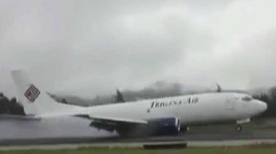 Plane skids down runway after landing gear snaps off