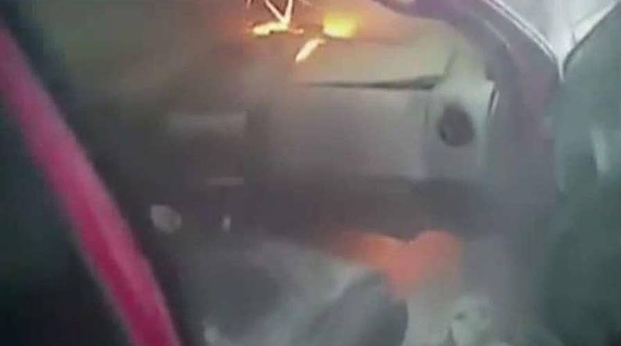 Officers, good Samaritans rescue man from burning truck