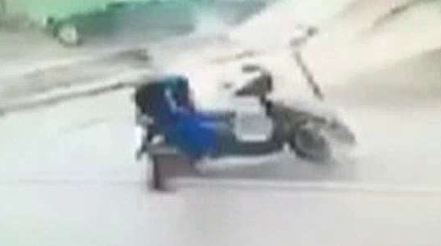 Man knocked off his motorbike by flying debris in Taiwan