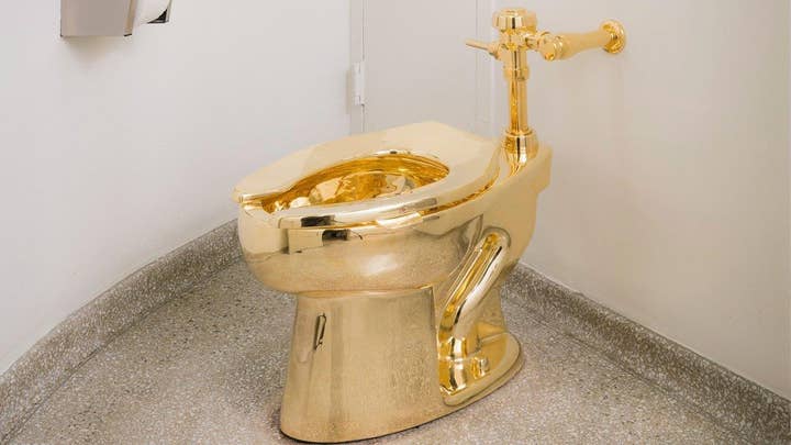 NYC museum's 18-karat golden toilet opens for business