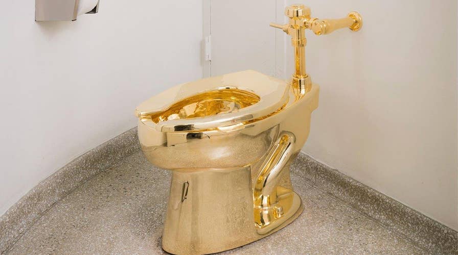 NYC museum's 18-karat golden toilet opens for business