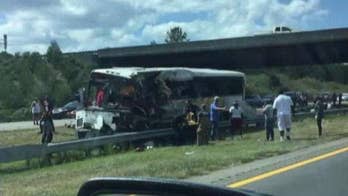 At least 4 dead, dozens hurt after bus carrying football players hits overpass