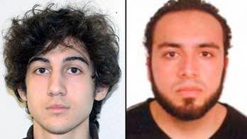 Suspect in New York, New Jersey bombings charged with shooting officer, awaits federal charges