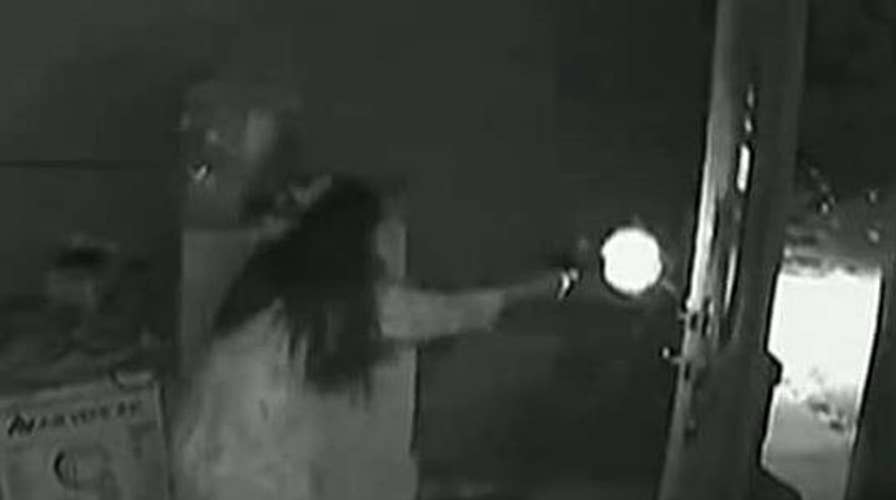 Woman opens fire on three home invaders