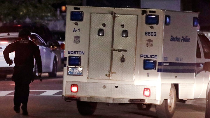 Boston police officers shot by suspect 'armed for battle'