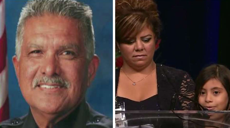 Daughter of slain police officer speaks at memorial vigil