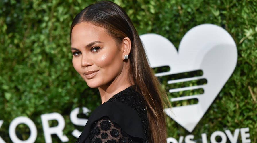 Chrissy Teigen: I hold my baby fine