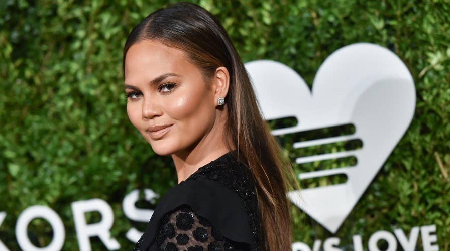 Chrissy Teigen: I hold my baby fine