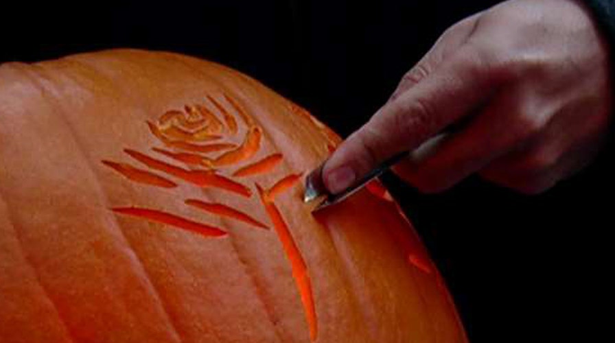 Adam Klotz shows off his pumpkin carving skills