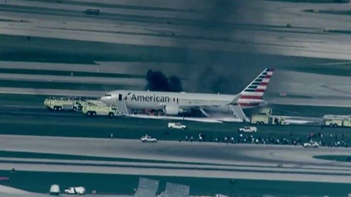 Jet blows tire, aborts takeoff, catches fire in Chicago