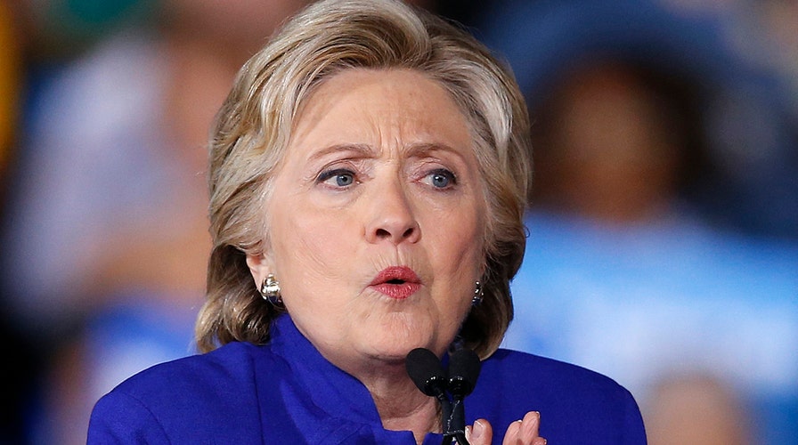 FBI investigating casts shadow over Clinton campaign