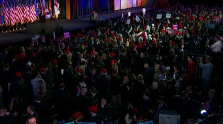 Trump supporters wait impatiently at election HQ