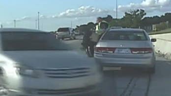 Caught on video: Officer dodges to avoid out-of-control car before crash