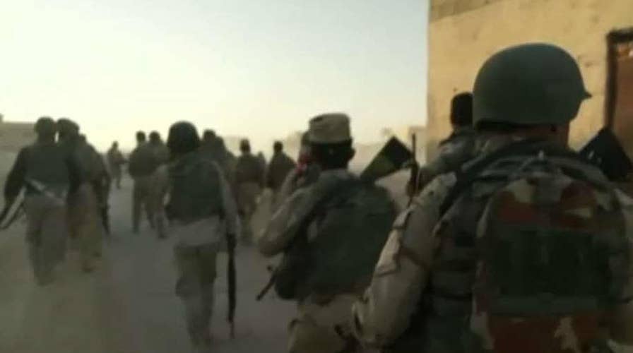 Iraqi forces advance into Mosul under heavy fire