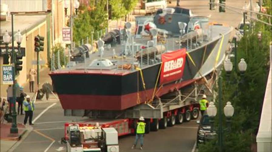 Restored PT boat travels through streets of New Orleans