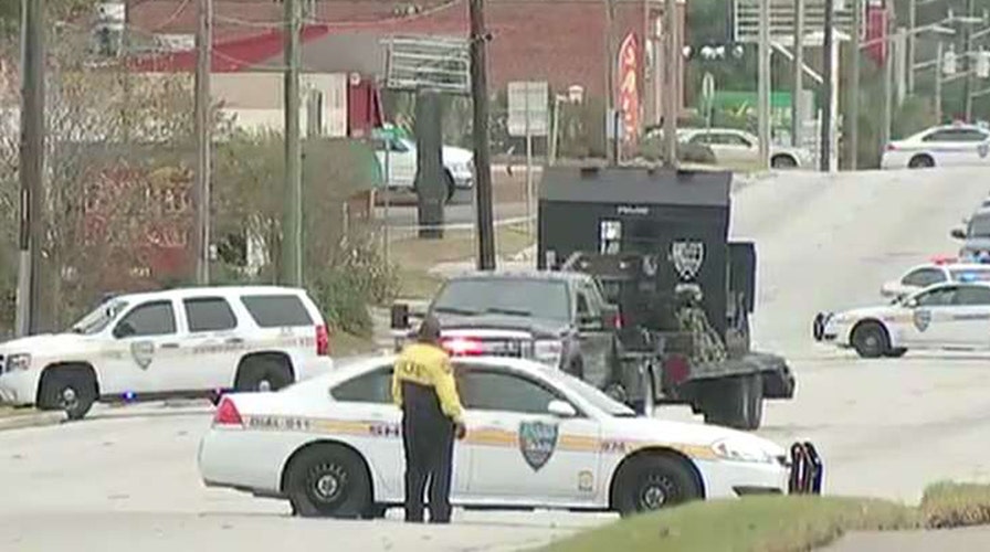 Report: Hostages freed, armed bank robber surrenders