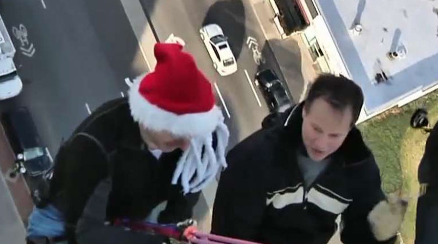 Rick Reichmuth gears up for rappelling with Santa