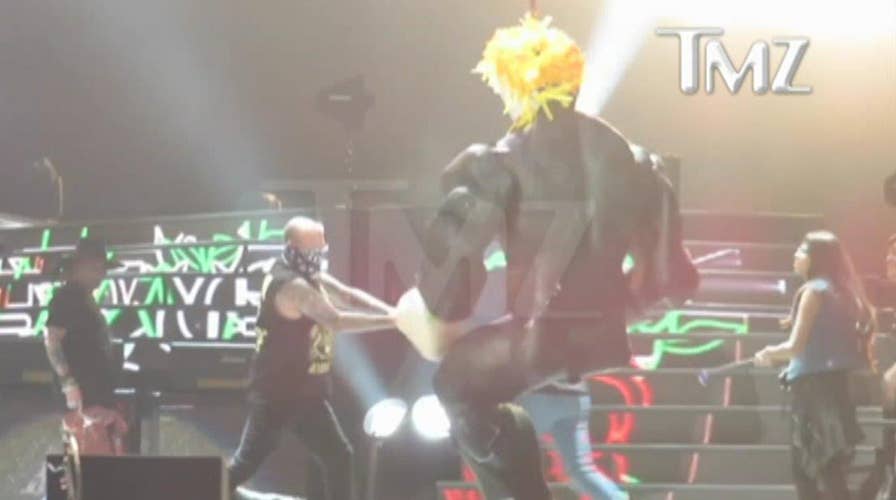 Guns 'n Roses fans beat on Trump pinata in Mexico City