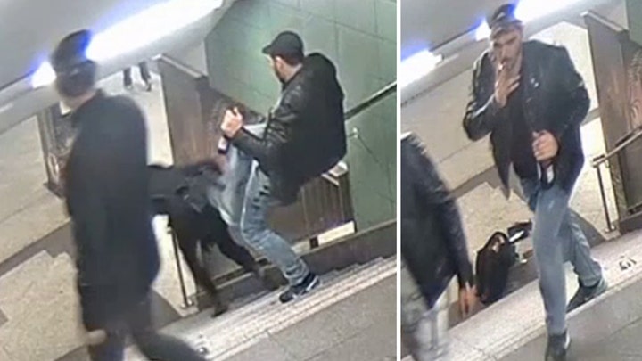 Man kicks woman down stairs at train station