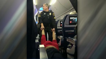 Woman dragged off Delta flight by police after reportedly  failing to check in at gate