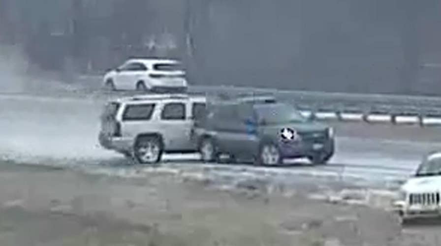 Skidding SUV flips cop cruiser after crash on icy road