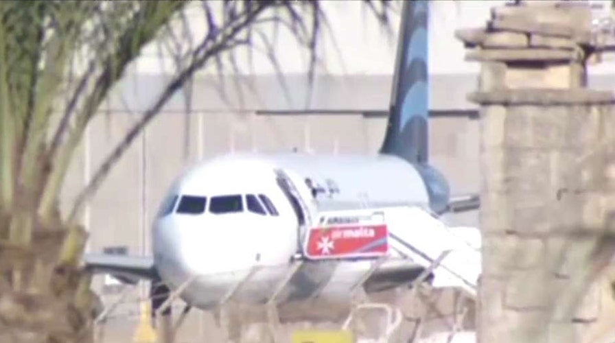 Hijacking suspects reportedly letting passengers off plane