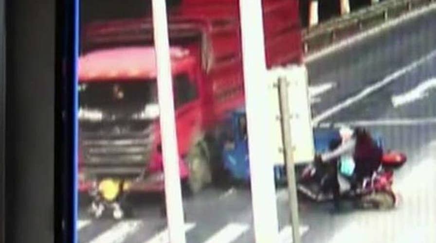 Toddler walks away after stroller is hit by truck