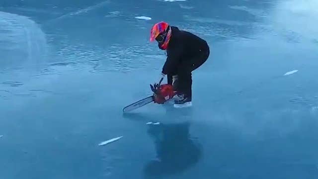 Ice skater uses chainsaw to zip across frozen lake