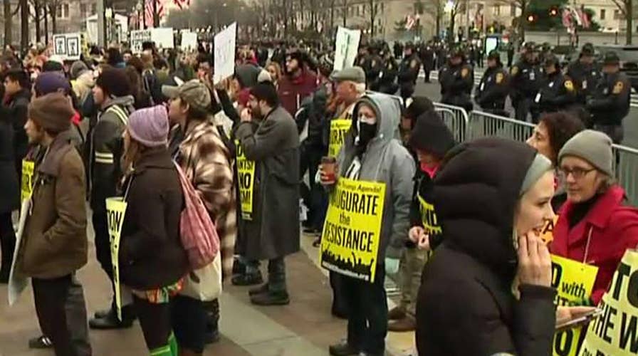 Protest groups gather steps from the inauguration