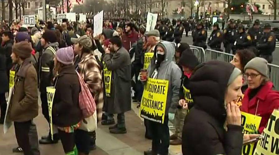 Protest groups gather steps from the inauguration