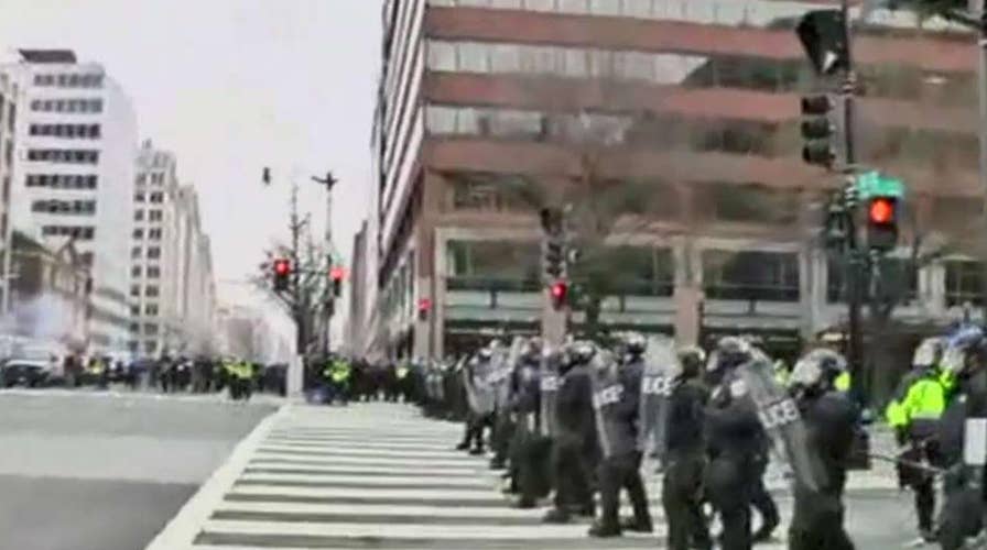 Riot police charge DC protesters