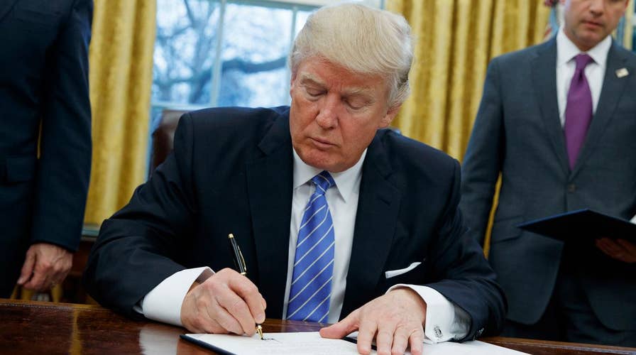 Trump signs three executive orders on Day One