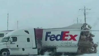 Train smashes through FedEx truck on video