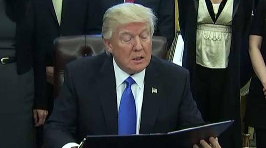 Trump signs orders on lobbying ban and plan to defeat ISIS