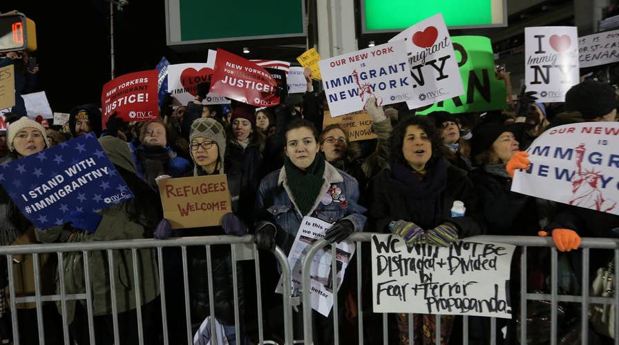 Passengers still detained at JFK airport