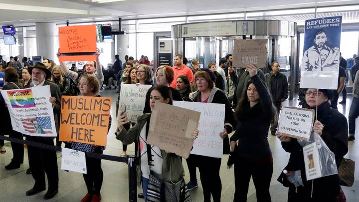 Liberals vow to defy President's immigration order