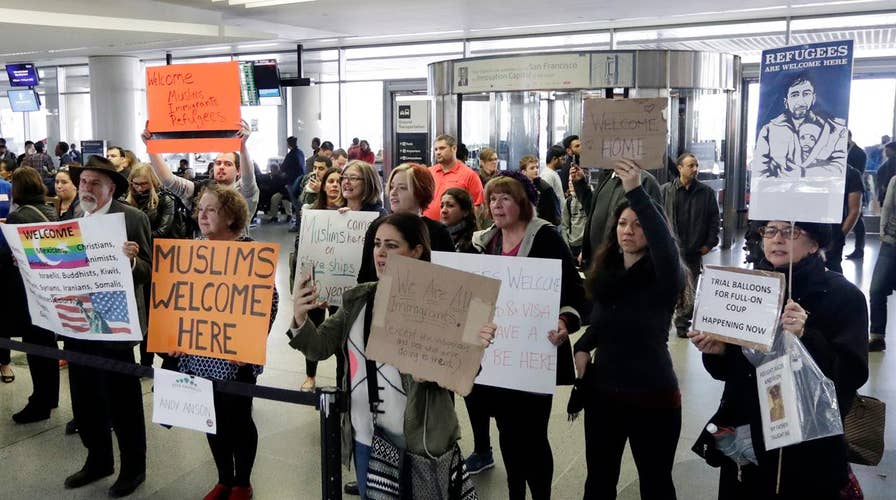 Liberals vow to defy President's immigration order