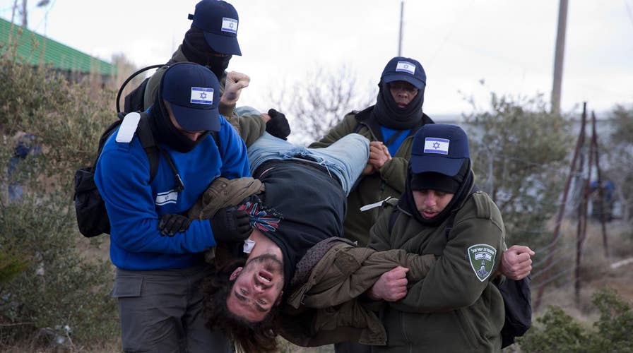 Israeli forces evacuating settlers from West Bank outpost