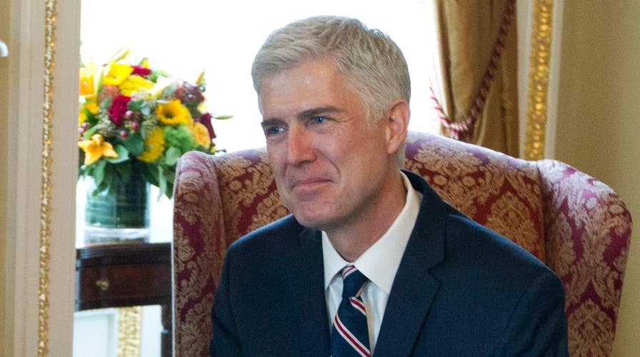 Trump urges Gorsuch confirmation, puts Iran on notice