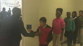 NC teacher has personalized handshakes with each of his students