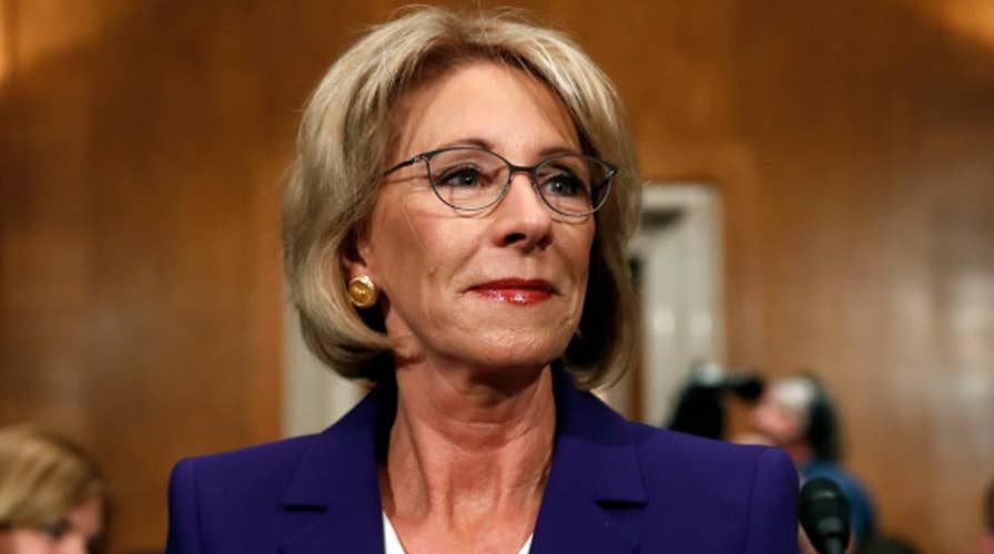 Democrats looking to defeat a Trump nominee target DeVos