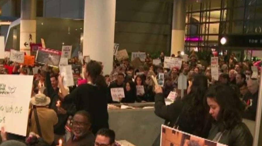 Confusion at airports after judge blocks Trump's travel ban