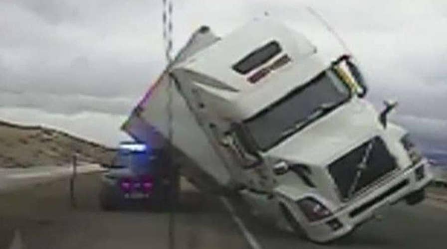 Semi-truck crushes cop cruiser