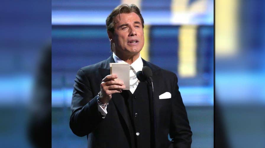 John Travolta can't read teleprompter at Grammys