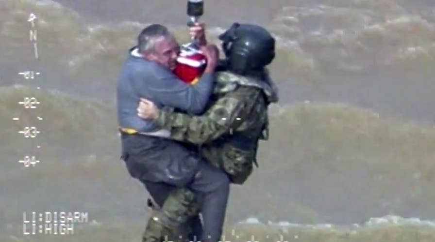 Elderly man swept into rushing water airlifted to safety