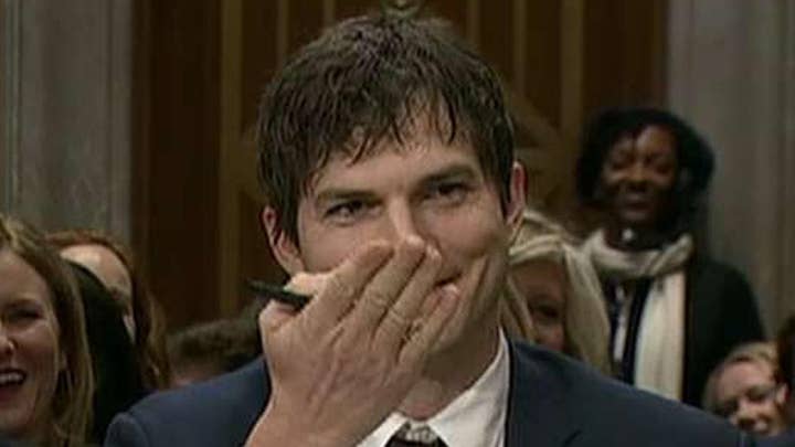 Ashton Kutcher blows kiss to John McCain during hearing