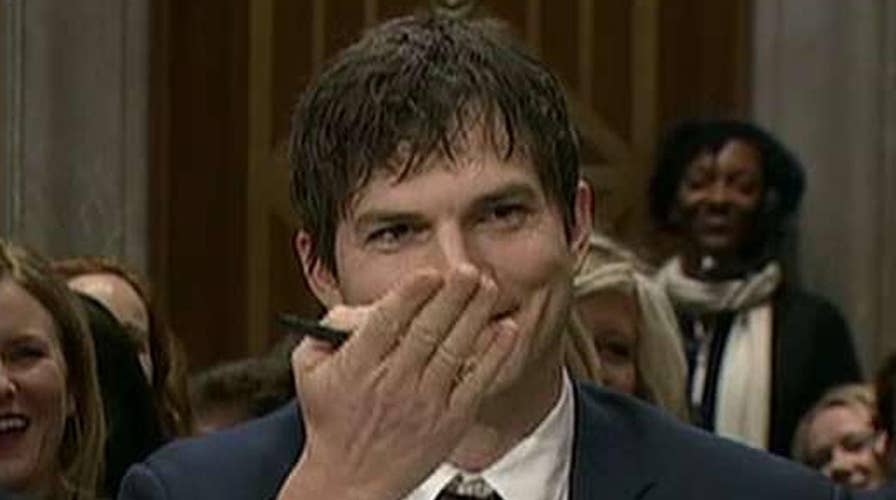 Ashton Kutcher blows kiss to John McCain during hearing