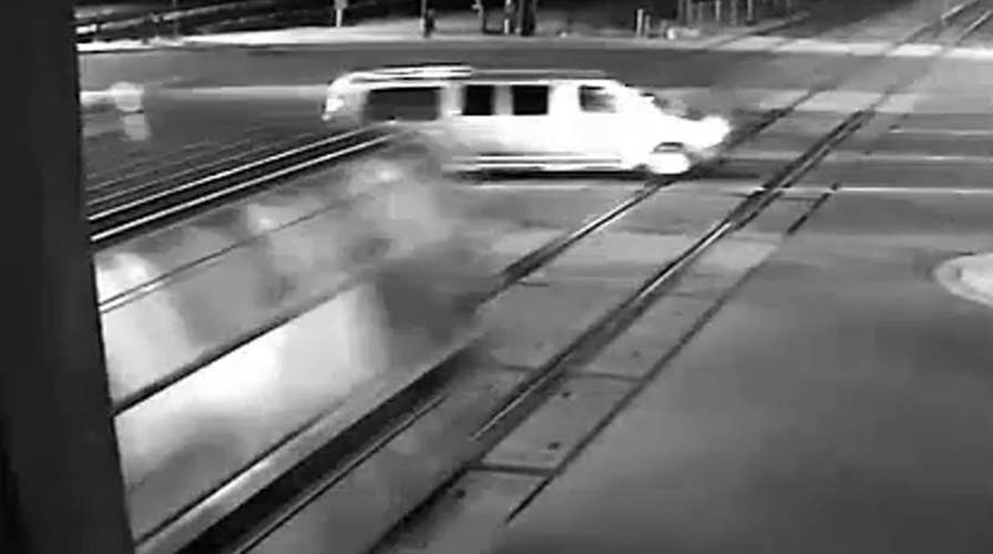 Van appears to purposely drive into train's path in crash