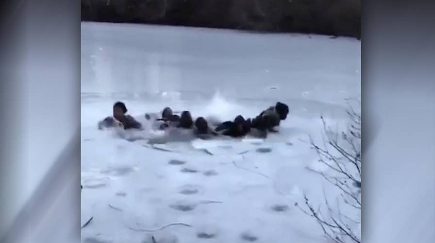 Youths struggle after falling through icy Central Park pond