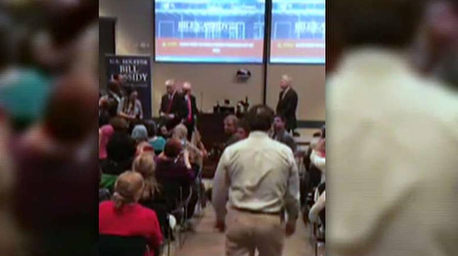 Protesters disrupt prayer at Sen. Bill Cassidy's town hall